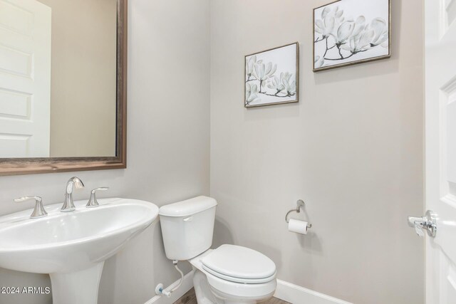 bathroom with toilet and sink