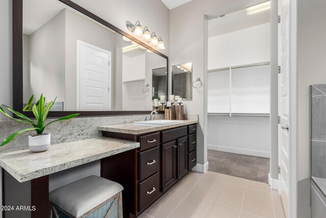 bathroom with tile patterned floors and vanity