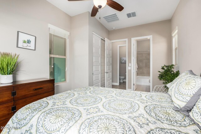 bedroom with connected bathroom, ceiling fan, and a closet