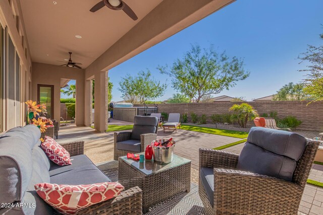 view of patio with ceiling fan and outdoor lounge area