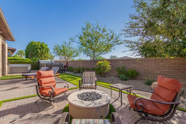 view of patio featuring an outdoor living space with a fire pit