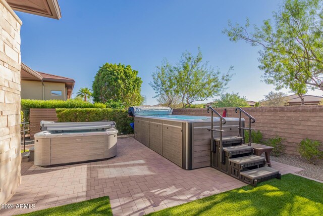 view of patio featuring a hot tub