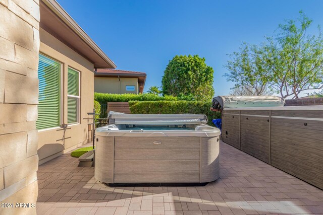 view of patio / terrace featuring a hot tub