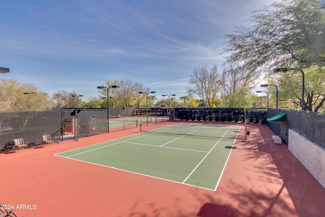 view of tennis court featuring basketball court