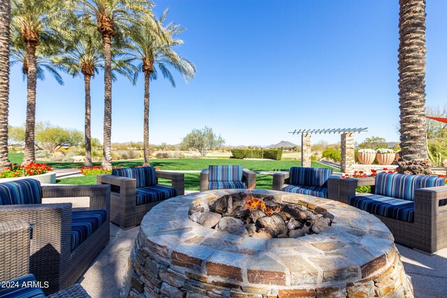 view of patio featuring an outdoor fire pit