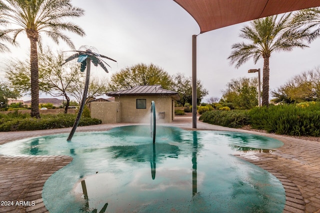 view of swimming pool with a patio