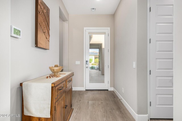 entryway with light hardwood / wood-style flooring