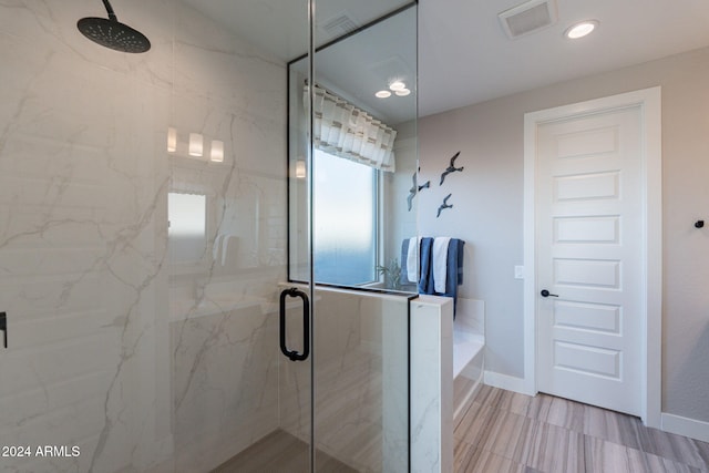 bathroom with an enclosed shower