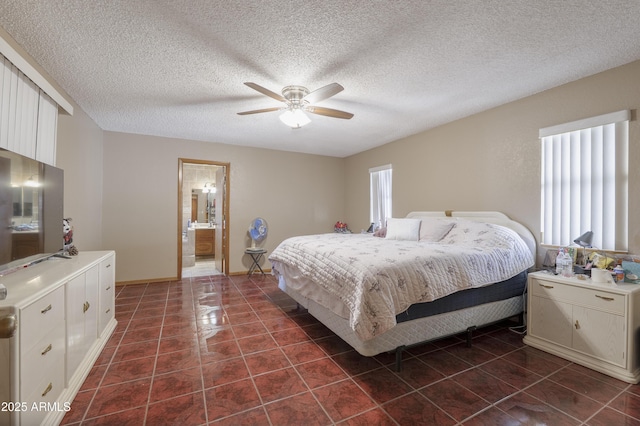 1285 E Mcmurray Blvd, Casa Grande, AZ 85122 - bedroom featuring dark tile patterned flooring, ceiling fan, a textured ceiling, and baseboards