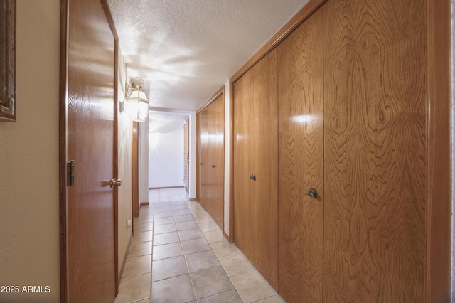 1285 E Mcmurray Blvd, Casa Grande, AZ 85122 - corridor with a textured ceiling and light tile patterned floors