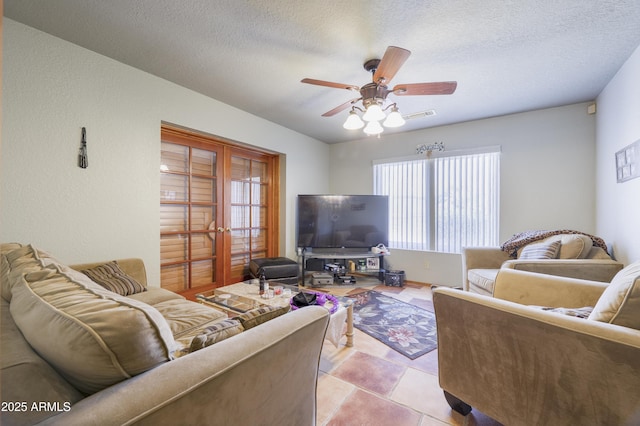 1285 E Mcmurray Blvd, Casa Grande, AZ 85122 - living area featuring a ceiling fan, a textured ceiling, and light tile patterned flooring