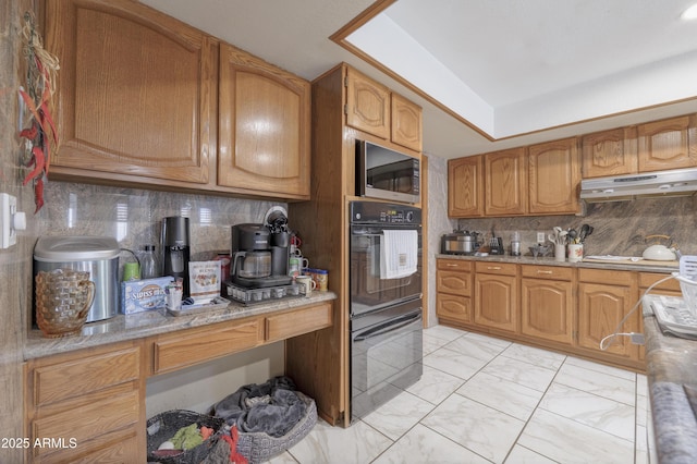 1285 E Mcmurray Blvd, Casa Grande, AZ 85122 - kitchen with under cabinet range hood, stainless steel microwave, light marble finish flooring, decorative backsplash, and stovetop
