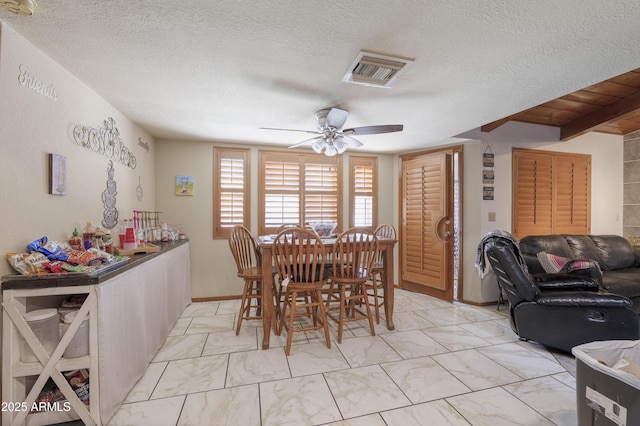1285 E Mcmurray Blvd, Casa Grande, AZ 85122 - dining space featuring a ceiling fan, a textured ceiling, and light marble finish flooring