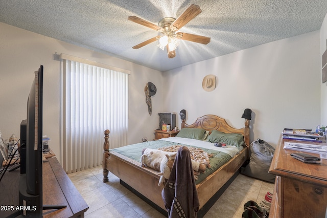 1285 E Mcmurray Blvd, Casa Grande, AZ 85122 - bedroom featuring light tile patterned floors, a textured ceiling, and a ceiling fan