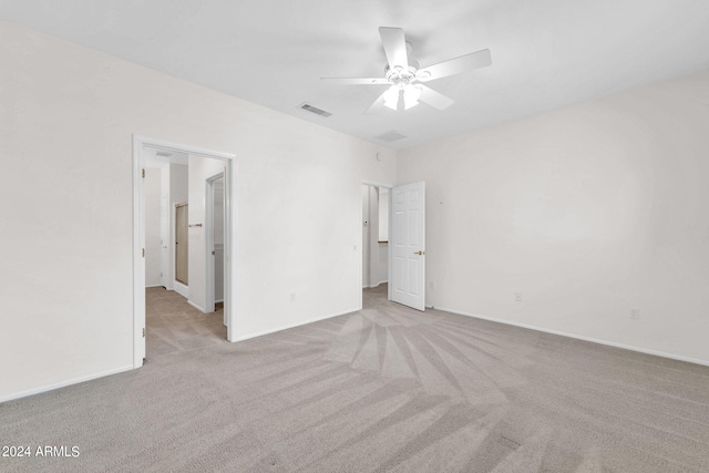 unfurnished bedroom with ceiling fan and light carpet