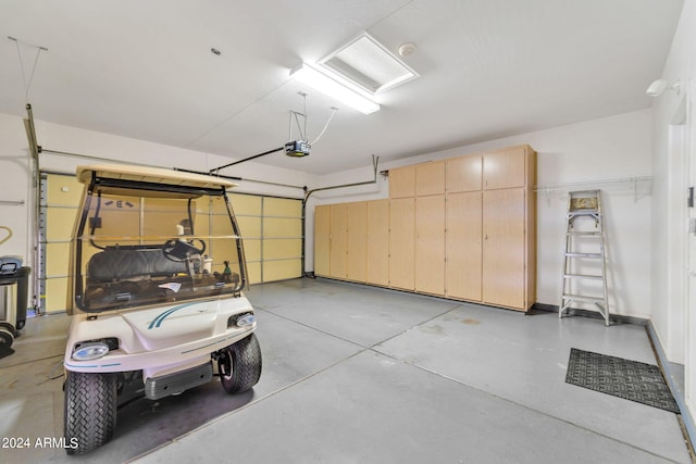 garage featuring a garage door opener