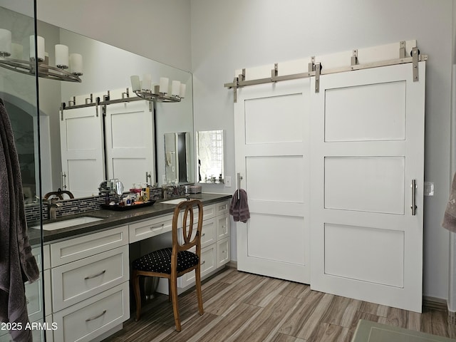 bathroom with vanity and hardwood / wood-style flooring