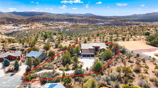 birds eye view of property featuring a mountain view