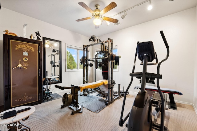 exercise area with baseboards, visible vents, ceiling fan, rail lighting, and carpet flooring