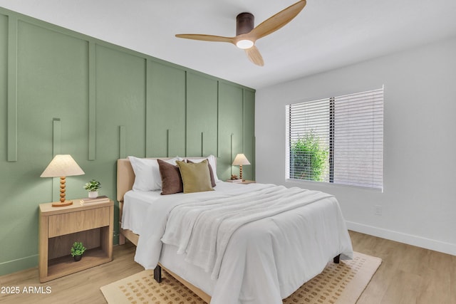 15435 N 28th St Unit 3, Phoenix, AZ 85032 - bedroom with baseboards, light wood-style flooring, and ceiling fan