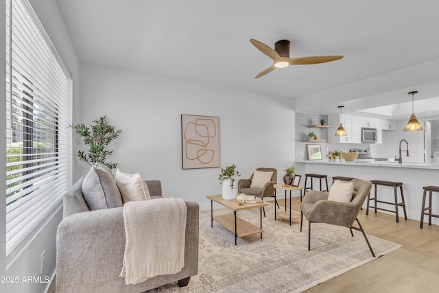 15435 N 28th St Unit 3, Phoenix, AZ 85032 - living room with light wood finished floors and a ceiling fan