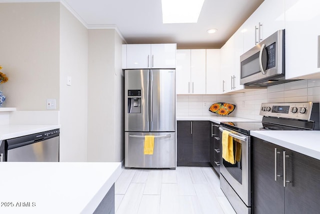 14300 W Bell Rd Unit 222, Surprise, AZ 85374 - kitchen featuring white cabinetry, backsplash, appliances with stainless steel finishes, and light countertops