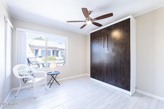 14300 W Bell Rd Unit 222, Surprise, AZ 85374 - living area with crown molding, a ceiling fan, light wood-style floors, and baseboards