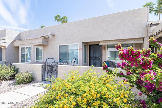 14300 W Bell Rd Unit 222, Surprise, AZ 85374 - view of front facade featuring a gate and stucco siding