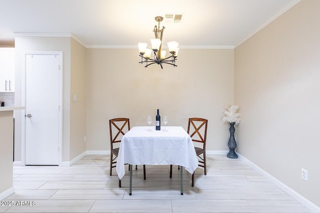14300 W Bell Rd Unit 222, Surprise, AZ 85374 - dining space featuring an inviting chandelier, ornamental molding, light wood-type flooring, baseboards, and visible vents