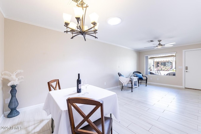 14300 W Bell Rd Unit 222, Surprise, AZ 85374 - dining area featuring visible vents, crown molding, ceiling fan with notable chandelier, and baseboards