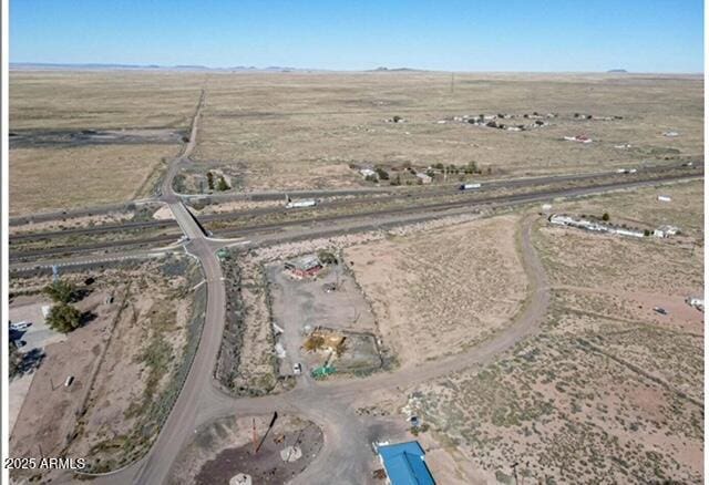 birds eye view of property featuring a rural view