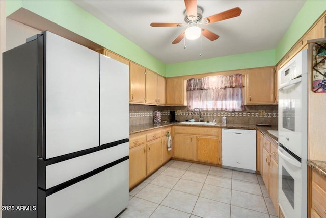 kitchen featuring sink, white appliances, decorative backsplash, and light tile patterned flooring