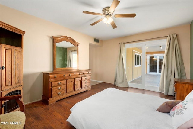 bedroom with ceiling fan, access to exterior, and dark wood-type flooring