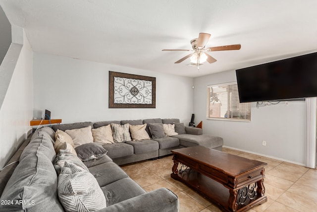 tiled living room with ceiling fan