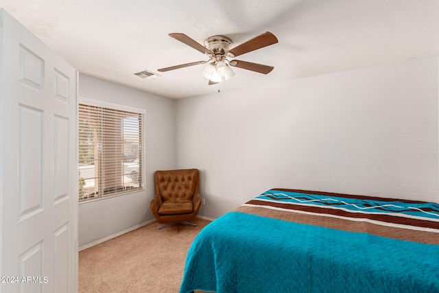 carpeted bedroom with ceiling fan