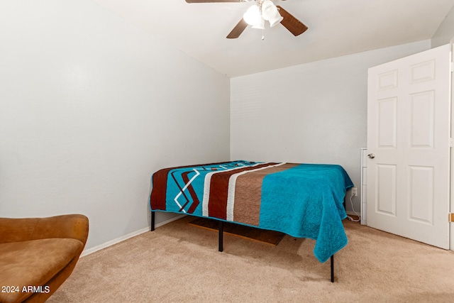 bedroom featuring ceiling fan and light colored carpet