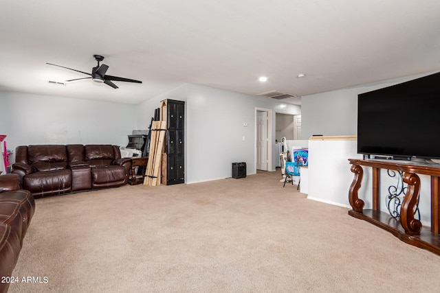 living room with ceiling fan and light carpet