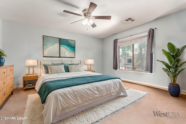 bedroom with a ceiling fan, carpet flooring, visible vents, and baseboards