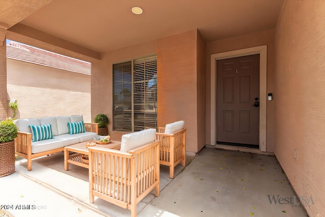 doorway to property featuring an outdoor hangout area and stucco siding