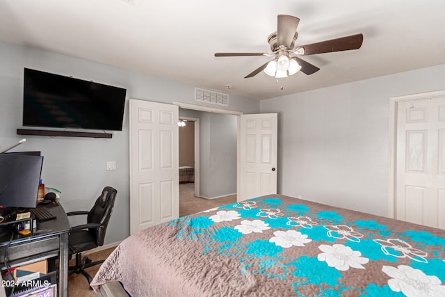 bedroom featuring ceiling fan and carpet