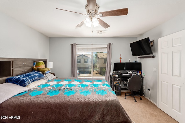 bedroom with light carpet and ceiling fan