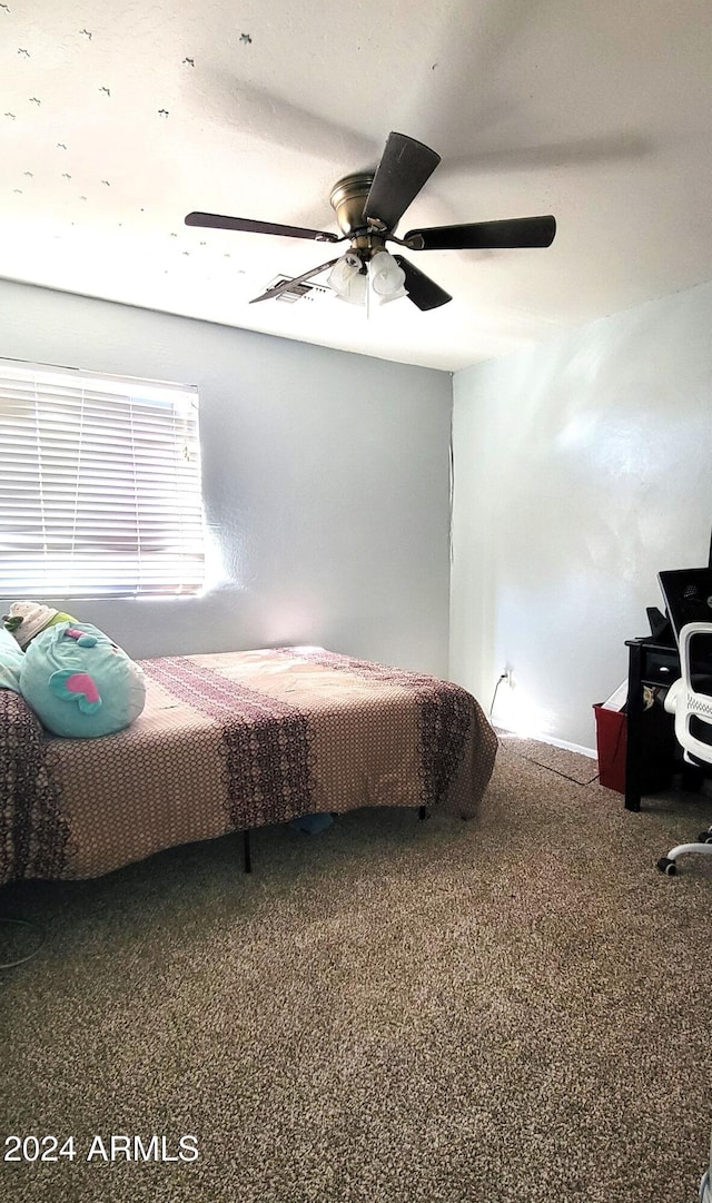 carpeted bedroom featuring a ceiling fan