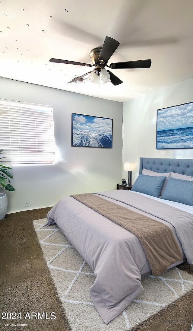 bedroom featuring carpet and a ceiling fan