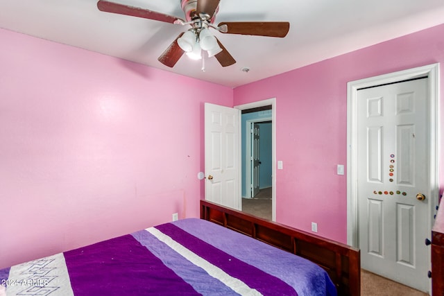 carpeted bedroom featuring ceiling fan