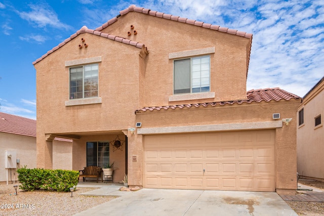 mediterranean / spanish-style home featuring a garage