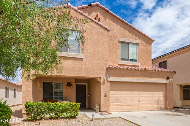 view of front of property with a garage