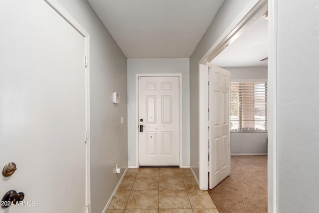 hallway with light tile patterned floors