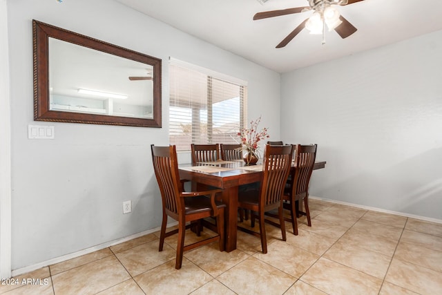 dining area with baseboards, a ceiling fan, and light tile patterned flooring