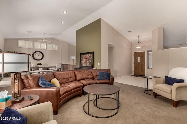 living room with lofted ceiling, light carpet, and ceiling fan