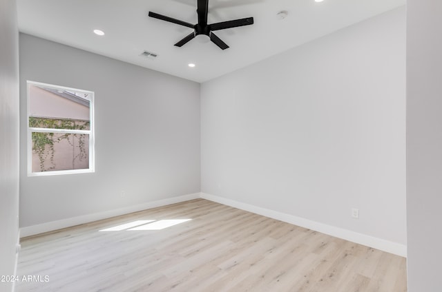 empty room featuring light wood-type flooring and ceiling fan